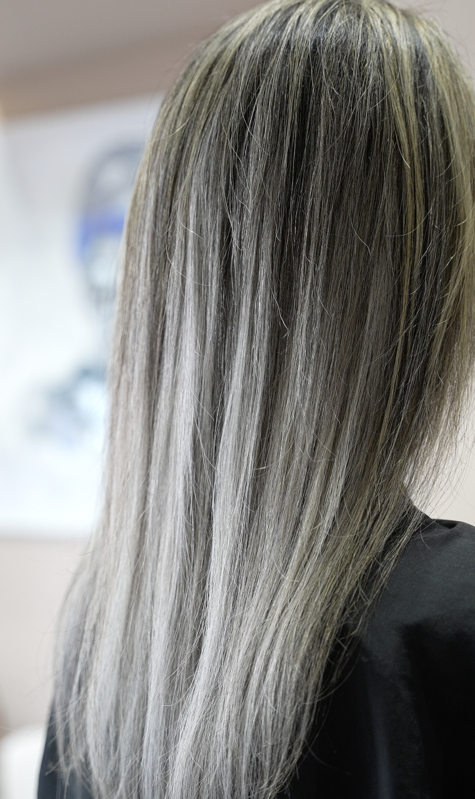 Long, poker-straight ash silver-blonde hair, a cool-toned colour result